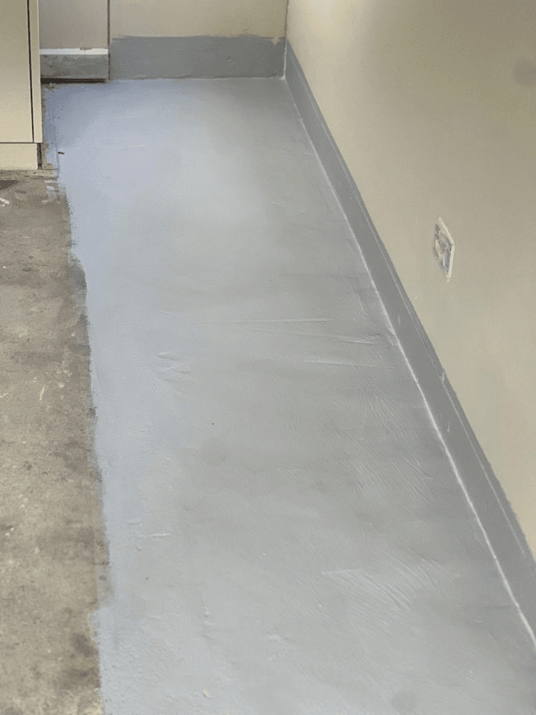 Fresh waterproofing membrane sealing the concrete floor
