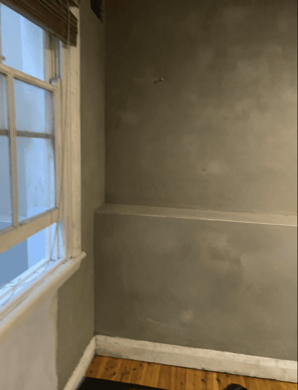 Grey waterproofing membrane coating interior walls at Barcom Ave Darlinghurst