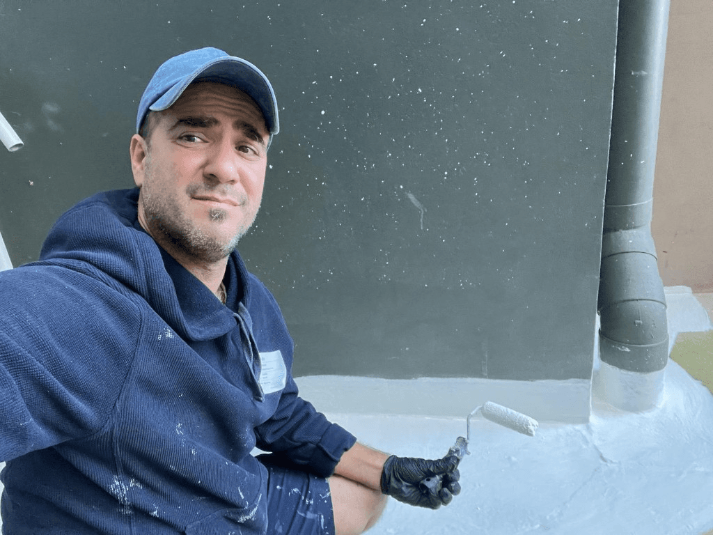 Issac Zorzano applying waterproofing membrane on site