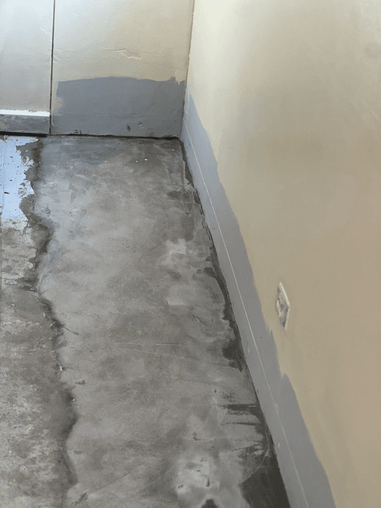 Negative pressure membrane applied along the floor and wall junction
