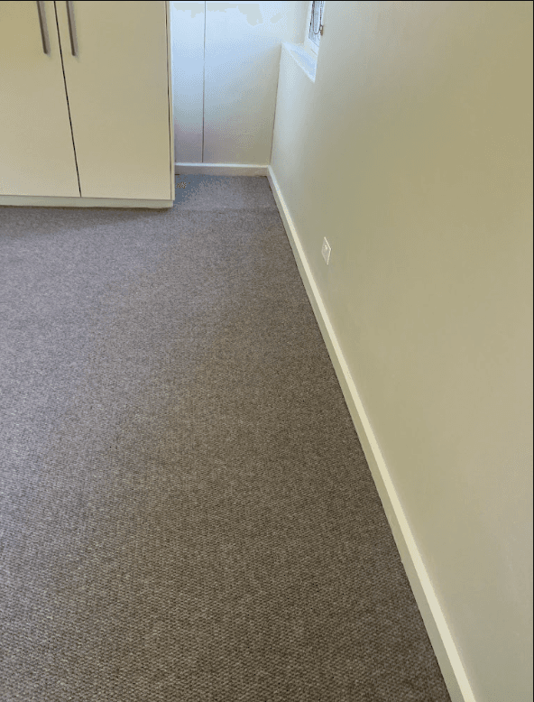 Room fully restored with new carpet after concrete cancer repair