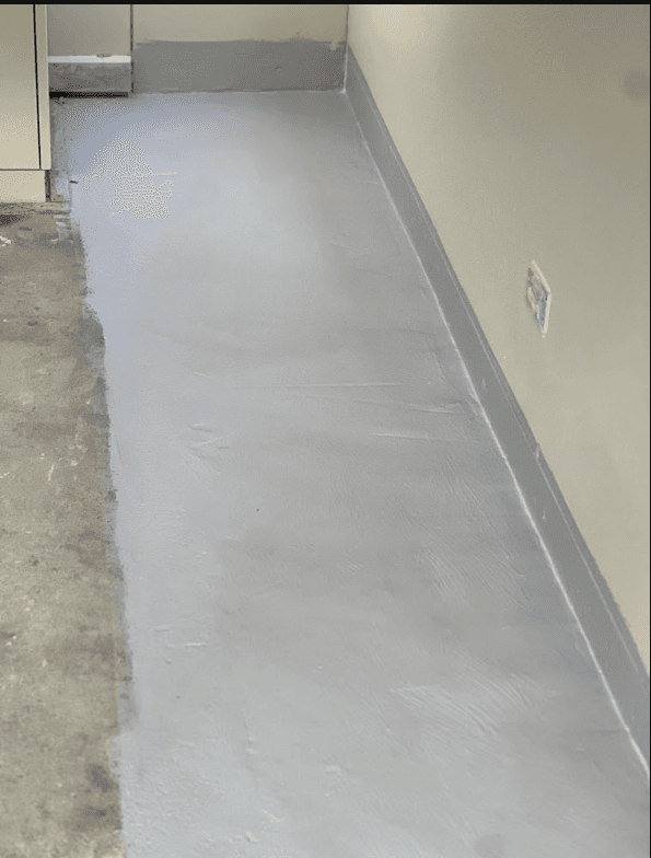 Negative pressure membrane applied along floor and wall junction