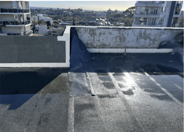 Waterproofing membrane applied to parapet wall corner at Bondi Junction